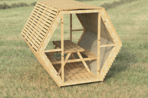 une structure hexagonale en bois avec une table de pique-nique